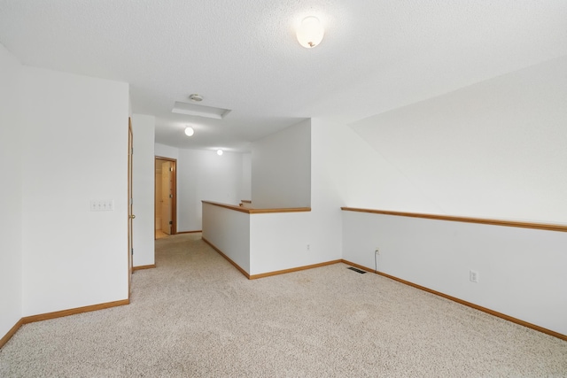 8741 Quarry Ridge Ln Unit H, Woodbury, MN 55125 - empty room featuring carpet flooring and attic access
