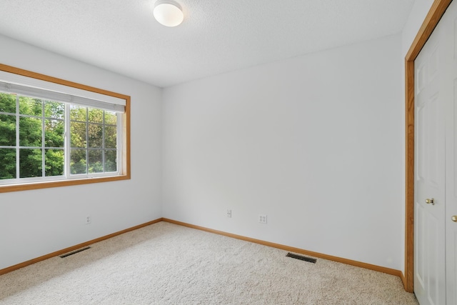 8741 Quarry Ridge Ln Unit H, Woodbury, MN 55125 - carpeted spare room with baseboards