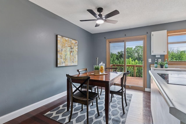 9700 265th St, Elko New Market, MN 55020 - dining room with dark wood-style flooring, a textured ceiling, and ceiling fan
