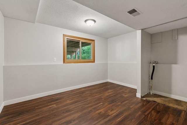 9700 265th St, Elko New Market, MN 55020 - empty room with dark wood-type flooring and a textured ceiling