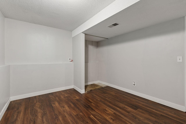 9700 265th St, Elko New Market, MN 55020 - unfurnished room featuring dark wood-type flooring and a textured ceiling
