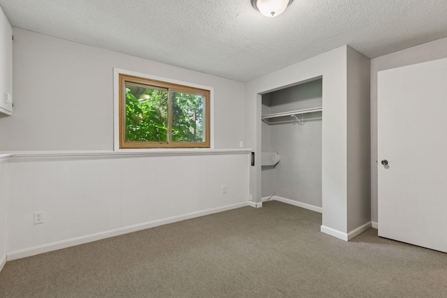 9700 265th St, Elko New Market, MN 55020 - unfurnished bedroom featuring carpet, a textured ceiling, and a closet