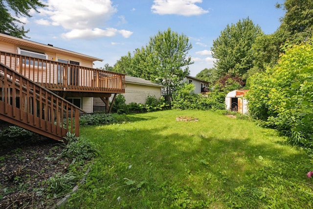 9700 265th St, Elko New Market, MN 55020 - view of green lawn with a storage shed and a wooden deck