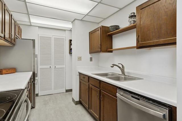 1181 Edgcumbe Rd Unit 501, Saint Paul, MN 55105 - kitchen with stainless steel appliances, open shelves, light countertops, and a paneled ceiling