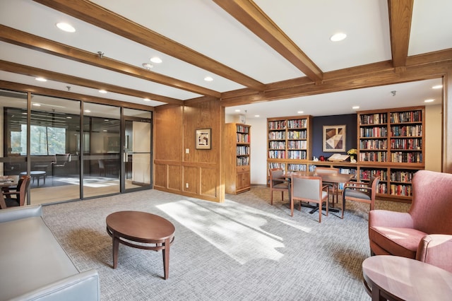1181 Edgcumbe Rd Unit 501, Saint Paul, MN 55105 - carpeted living area with beam ceiling, recessed lighting, wood walls, built in features, and wall of books