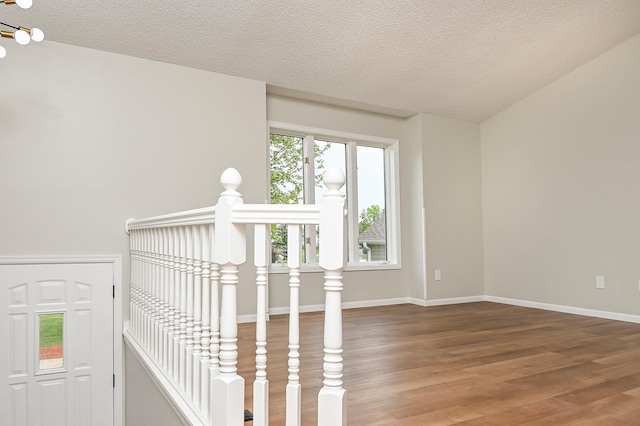 1527 Harvest Ln, Shakopee, MN 55379 - staircase featuring wood finished floors and a textured ceiling