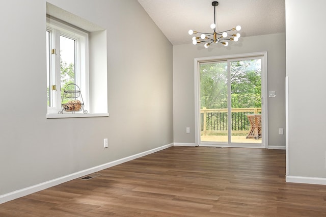 1527 Harvest Ln, Shakopee, MN 55379 - unfurnished room featuring a chandelier, wood finished floors, and lofted ceiling