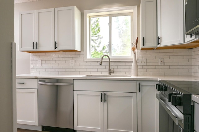 1527 Harvest Ln, Shakopee, MN 55379 - kitchen featuring appliances with stainless steel finishes, light countertops, backsplash, and white cabinetry