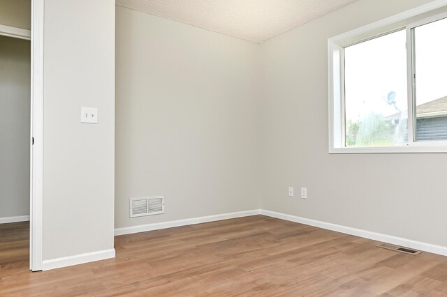 1527 Harvest Ln, Shakopee, MN 55379 - unfurnished room with light wood-style flooring