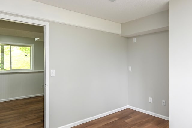 1527 Harvest Ln, Shakopee, MN 55379 - empty room featuring dark wood finished floors and baseboards