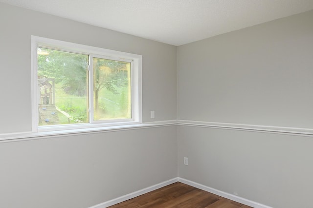 1527 Harvest Ln, Shakopee, MN 55379 - spare room featuring dark wood finished floors and baseboards