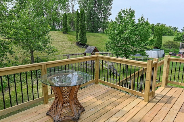 1527 Harvest Ln, Shakopee, MN 55379 - wooden terrace featuring a storage shed, a fenced backyard, and outdoor dining area