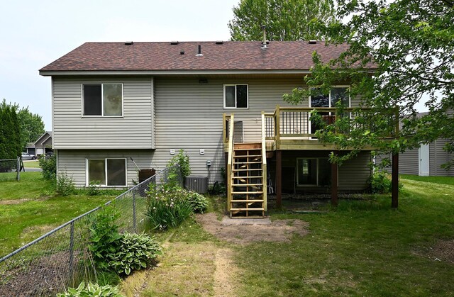 1527 Harvest Ln, Shakopee, MN 55379 - rear view of house with stairway, a wooden deck, a fenced backyard, and a shingled roof