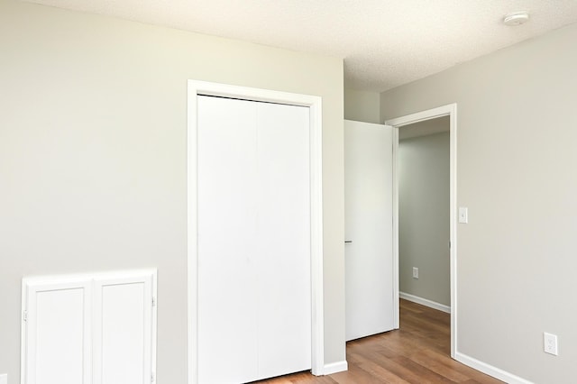 1527 Harvest Ln, Shakopee, MN 55379 - unfurnished bedroom with wood finished floors and a closet