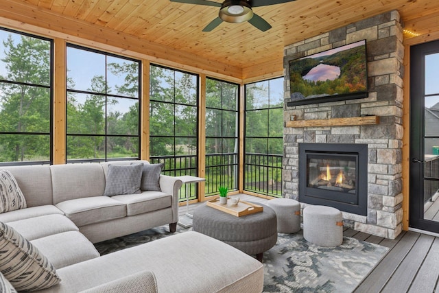 14217 Packard St NE, Ham Lake, MN 55304 - sunroom / solarium featuring ceiling fan and an outdoor living space with a fireplace