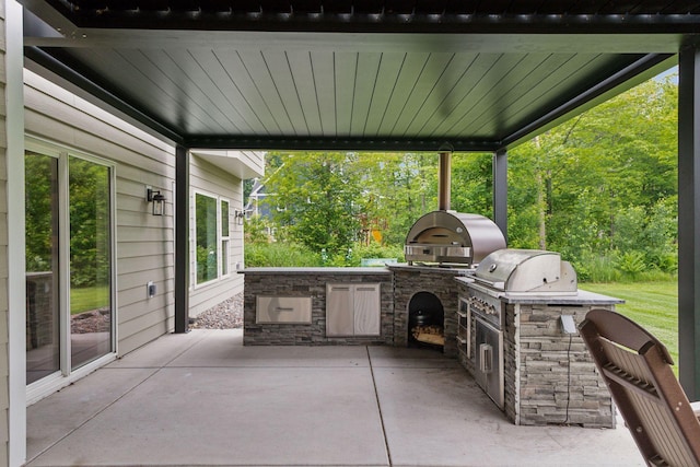 14217 Packard St NE, Ham Lake, MN 55304 - view of patio with an outdoor kitchen