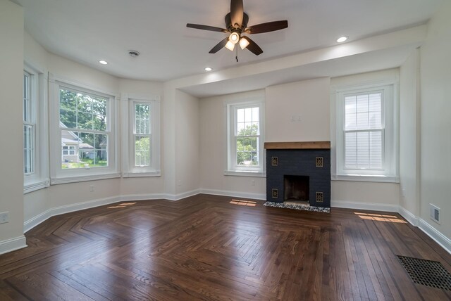 121 Hickory St, Chaska, MN 55318 - unfurnished living room with plenty of natural light, a ceiling fan, a fireplace, and recessed lighting