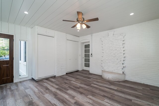121 Hickory St, Chaska, MN 55318 - foyer entrance featuring brick wall, wood finished floors, ceiling fan, recessed lighting, and wooden ceiling