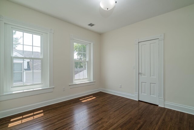 121 Hickory St, Chaska, MN 55318 - unfurnished room featuring dark wood finished floors and baseboards