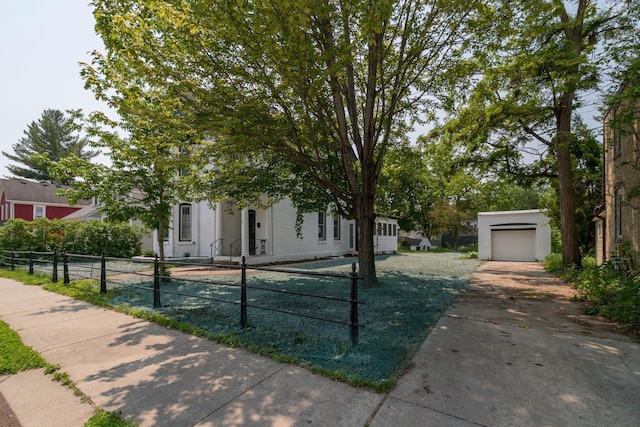 121 Hickory St, Chaska, MN 55318 - obstructed view of property featuring driveway and an outdoor structure
