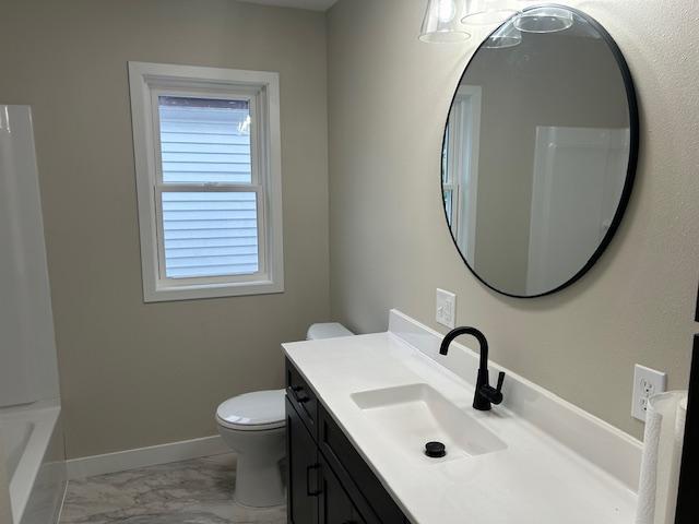 206 3rd St, Minneota, MN 56264 - bathroom featuring vanity and marble look tiles