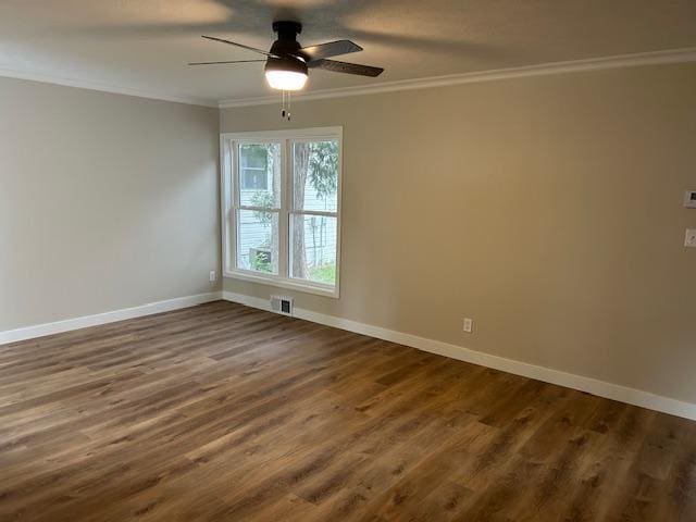 206 3rd St, Minneota, MN 56264 - unfurnished room featuring ceiling fan, crown molding, and dark wood-style floors