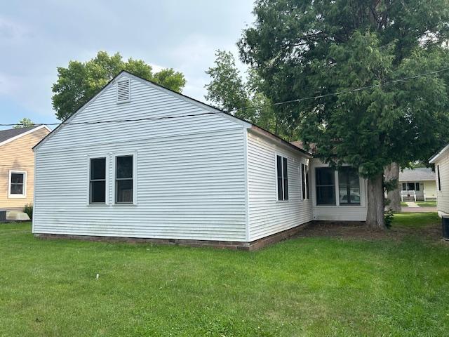 206 3rd St, Minneota, MN 56264 - view of property exterior featuring a yard