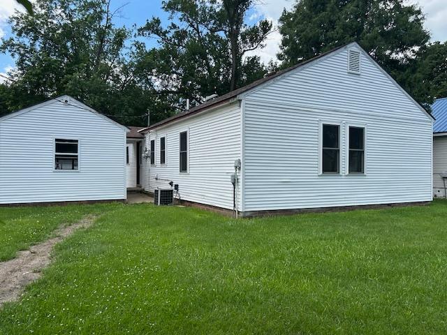 206 3rd St, Minneota, MN 56264 - view of home's exterior featuring a yard