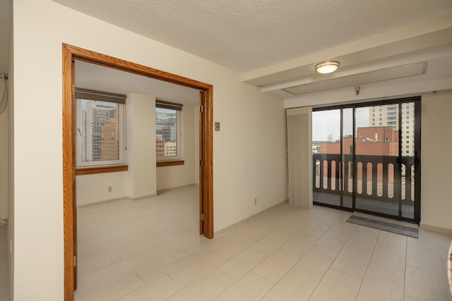 220 Broadway Ave S Unit 1221, Rochester, MN 55904 - empty room with healthy amount of natural light and a textured ceiling