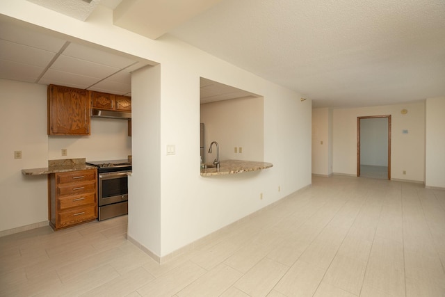 220 Broadway Ave S Unit 1221, Rochester, MN 55904 - kitchen featuring electric range, under cabinet range hood, brown cabinetry, and light stone counters