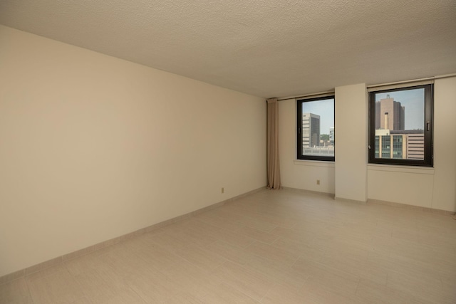 220 Broadway Ave S Unit 1221, Rochester, MN 55904 - spare room with a textured ceiling