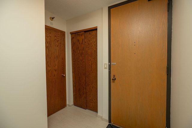 220 Broadway Ave S Unit 1221, Rochester, MN 55904 - corridor featuring light tile patterned flooring