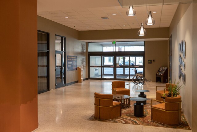 220 Broadway Ave S Unit 1221, Rochester, MN 55904 - common area with a paneled ceiling and a high ceiling