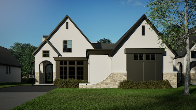 9919 Crestwood Ter, Eden Prairie, MN 55347 - view of front of property featuring stucco siding, a front lawn, and stone siding