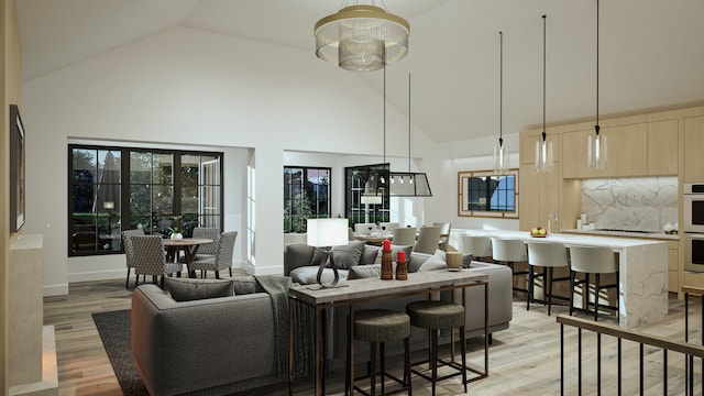 9919 Crestwood Ter, Eden Prairie, MN 55347 - living room with high vaulted ceiling, light wood-style flooring, and a chandelier