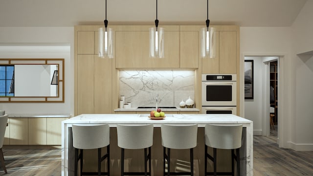 9919 Crestwood Ter, Eden Prairie, MN 55347 - kitchen with light brown cabinetry, white double oven, modern cabinets, a kitchen breakfast bar, and light stone countertops
