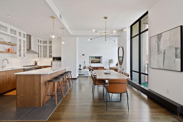 201 11th St Unit 530, Minneapolis, MN 55403 - dining space with healthy amount of natural light, expansive windows, dark wood-type flooring, and a chandelier