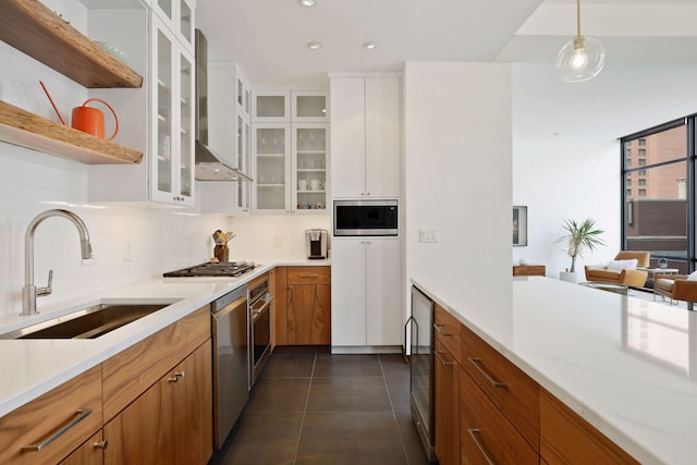 201 11th St Unit 530, Minneapolis, MN 55403 - kitchen featuring stainless steel appliances, brown cabinetry, light countertops, decorative backsplash, and white cabinets