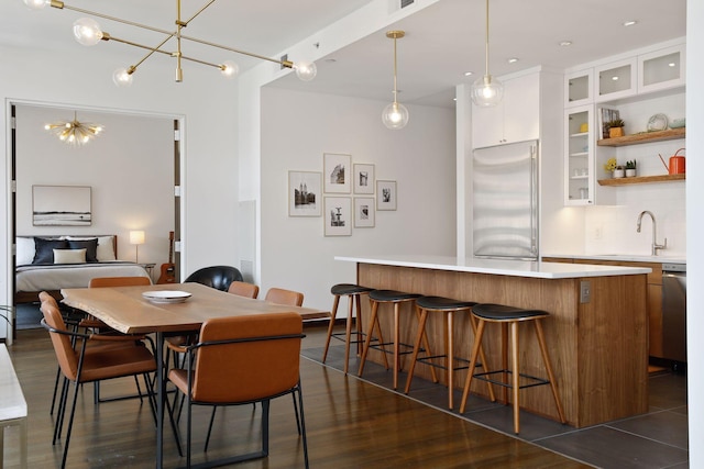 201 11th St Unit 530, Minneapolis, MN 55403 - dining room featuring dark wood-style flooring and a chandelier