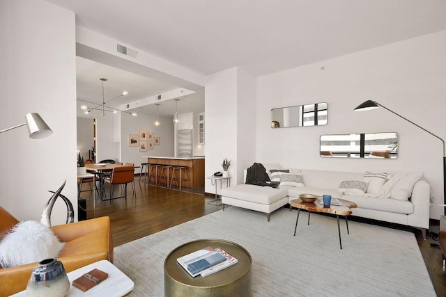 201 11th St Unit 530, Minneapolis, MN 55403 - living area with dark wood-type flooring and a chandelier