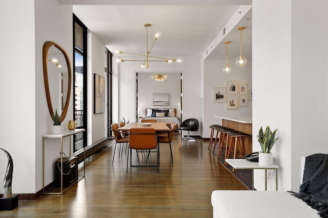 201 11th St Unit 530, Minneapolis, MN 55403 - dining space with dark wood-style flooring and a chandelier