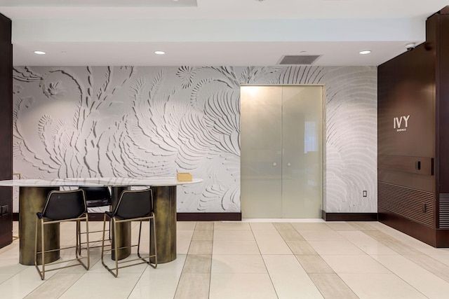 201 11th St Unit 530, Minneapolis, MN 55403 - common area with wallpapered walls, recessed lighting, and a surveillance system