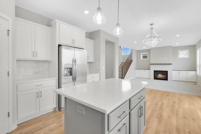 14320 Alder Way, Rosemount, MN 55068 - kitchen featuring refrigerator with ice dispenser, plenty of natural light, light wood-type flooring, a center island, and recessed lighting