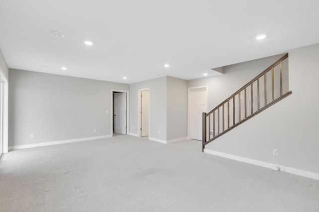 14320 Alder Way, Rosemount, MN 55068 - unfurnished living room featuring light colored carpet, recessed lighting, and stairway