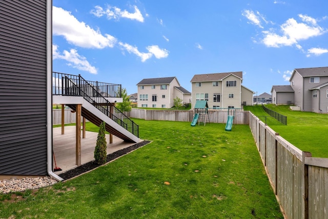 14320 Alder Way, Rosemount, MN 55068 - fenced backyard with a residential view, stairs, a playground, and a patio area