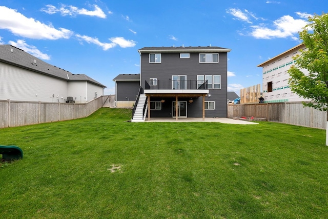 14320 Alder Way, Rosemount, MN 55068 - rear view of property featuring a patio, a fenced backyard, stairs, and a wooden deck