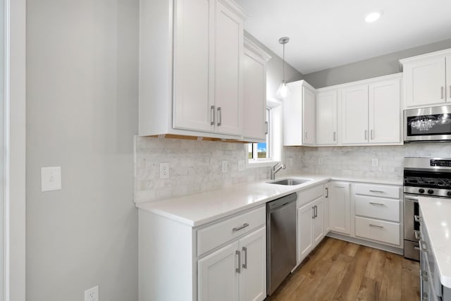 14320 Alder Way, Rosemount, MN 55068 - kitchen with stainless steel appliances, white cabinets, and light wood-style floors