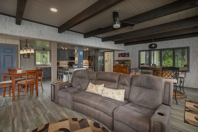 40536 Ryans Bay Rd, Zumbro Twp, MN 55991 - living area with wood finished floors, ceiling fan, and a wood ceiling with exposed beams