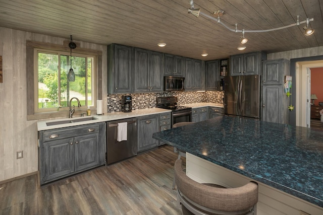 40536 Ryans Bay Rd, Zumbro Twp, MN 55991 - kitchen with stainless steel appliances, wooden ceiling, gray cabinetry, dark wood-style floors, and decorative backsplash
