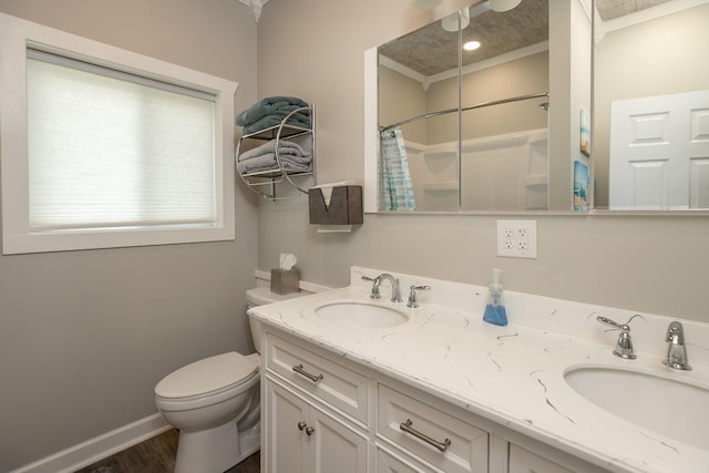 40536 Ryans Bay Rd, Zumbro Twp, MN 55991 - bathroom with double vanity, curtained shower, crown molding, and wood finished floors